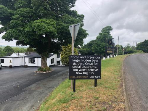 a street sign on the side of a road at The Dog & Partridge Country Inn in Ashbourne