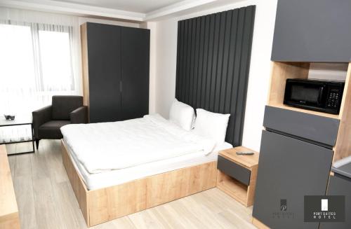Posteľ alebo postele v izbe v ubytovaní Pars Suites Hotel