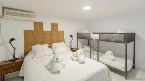 a bedroom with a bed with two bunk beds at La Guitarra Andaluza Loja by Ruralidays in Loja