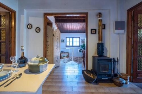 a kitchen with a table and a stove in a room at Guest House Sklithro in Sklíthron