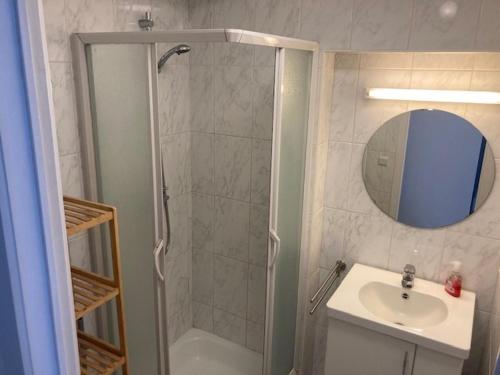 a bathroom with a shower and a sink at Oostduinkerke Apartments in Oostduinkerke