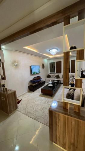 a living room with a couch and a table at Appartement de Lux Hay Al MATAR in Nador