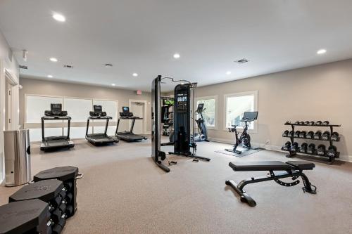 a gym with several treadmills and exercise bikes at WaterWalk Extended Stay by Wyndham Atlanta Perimeter in Atlanta