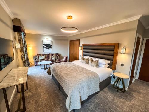 Un ou plusieurs lits dans un hébergement de l'établissement Lodore Falls Hotel & Spa