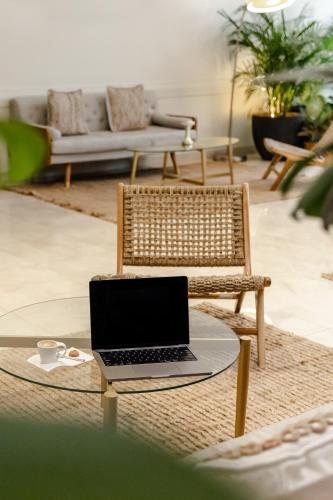 a laptop sitting on a coffee table in a living room at Holiday Inn Hotel Port of Miami-Downtown by IHG in Miami