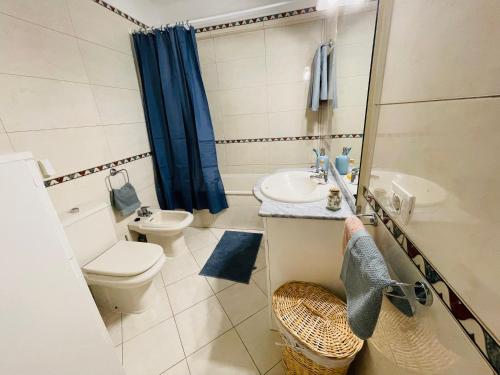 a small bathroom with a toilet and a sink at Mona's Point Tenerife in San Miguel de Abona