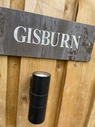 a black solo cup sitting on a wooden fence at Valley View Pendle in Foulridge