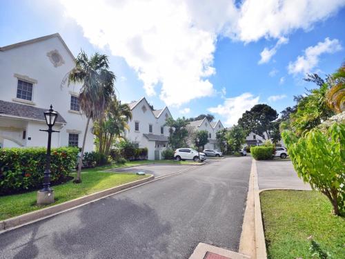 a street in a residential neighborhood with houses at Gunsite 28 by BSL Rentals in Bridgetown