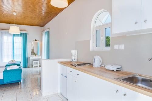 Kuchyň nebo kuchyňský kout v ubytování Porto Giardino Apartments