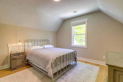 a bedroom with a bed and a window at Spacious Lake Sinclair Vacation Rental with Dock! in Resseaus Crossroads