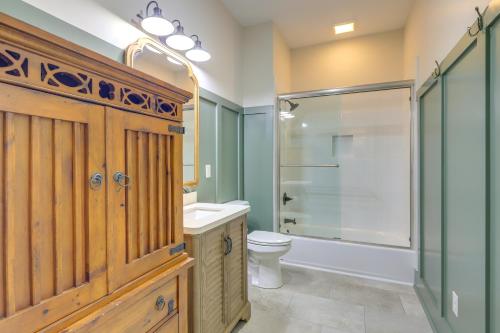 a bathroom with a toilet and a shower and a sink at Spacious Lake Sinclair Vacation Rental with Dock! in Resseaus Crossroads
