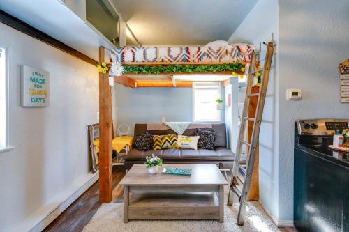 a living room with a bunk bed and a table at Fairbanks Vacation Rental Studio Near Downtown! in Fairbanks