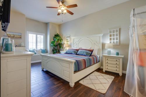 a bedroom with a bed and a ceiling fan at Las Vegas Condo Rental with Pool Access! in Las Vegas