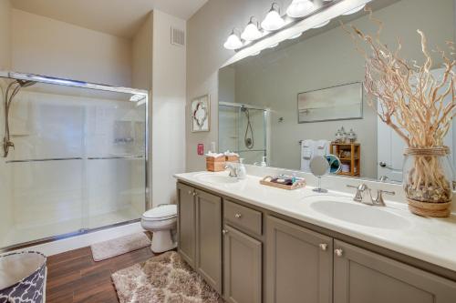 a bathroom with a sink and a toilet and a mirror at Las Vegas Condo Rental with Pool Access! in Las Vegas
