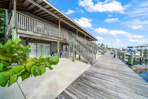 a boardwalk leading to a house with a dock at Sebastian Saltwater Lodge in Sebastian