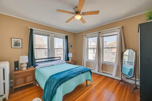 a bedroom with a bed and a ceiling fan at Revere Vacation Rental Near MBTA about 7 Mi to Boston! in Revere