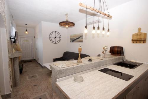 a kitchen with a counter top in a room at Apartments D in Premantura