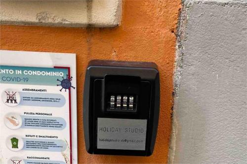 a cell phone is attached to a wall at Holiday Studio in Centro Storico Intra in Intra