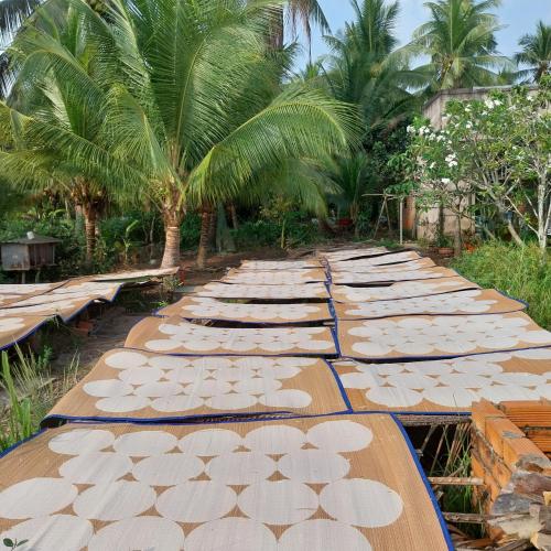 a long table with white umbrellas on it at BenTrestay in Giồng Tú Ðiền