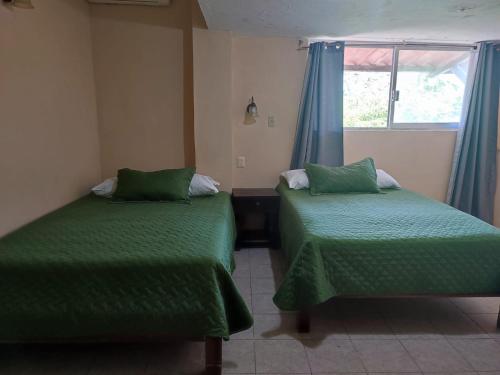 Postel nebo postele na pokoji v ubytování Hotel Rath