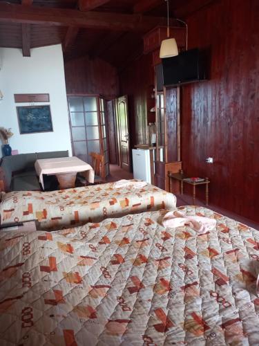 a bedroom with two large beds in a room at Villa Renesans in Star Dojran