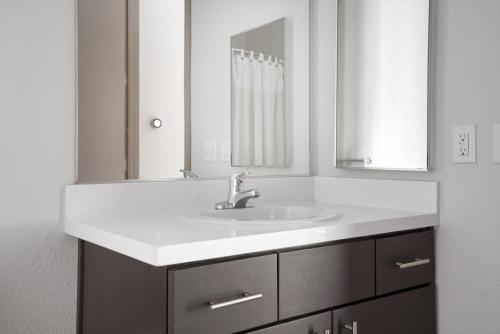 a bathroom with a white sink and a mirror at Sunnyvale studio w pool ac wd nr freeways SFO-1142 in Sunnyvale