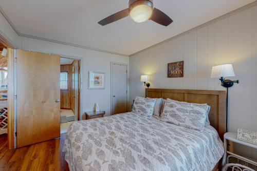 a bedroom with a bed and a ceiling fan at Stellar Vista in Avon