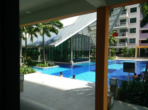 a view of the swimming pool at the hotel at Indah Alam Condo in Shah Alam