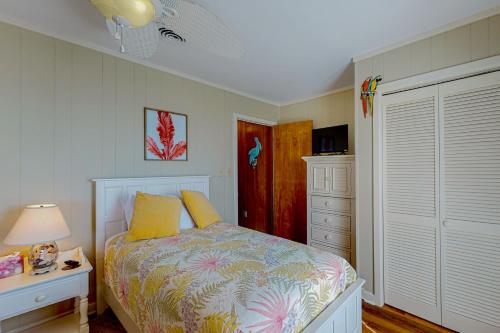a bedroom with a bed and a dresser and a lamp at Stellar Vista in Avon