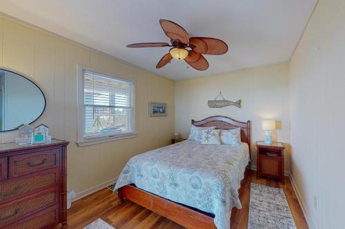 a bedroom with a bed and a ceiling fan at Stellar Vista in Avon
