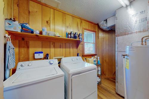 a kitchen with a washer and dryer and a refrigerator at Stellar Vista in Avon