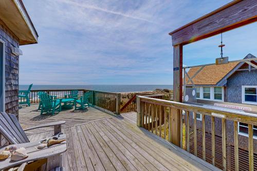 a large deck with a view of the ocean at Stellar Vista in Avon