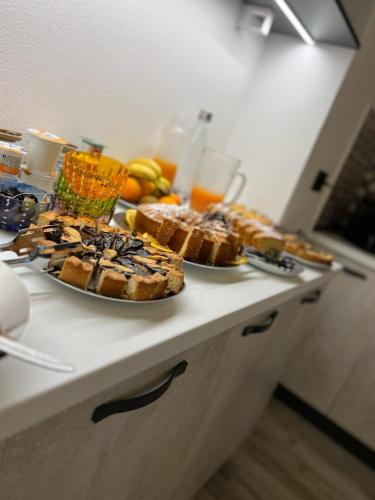 a table with two plates of bread and fruit on it at Il Gaudente B&B in Santa Fiora