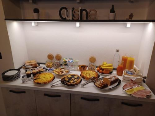 a table with many plates of food on it at Il Gaudente B&B in Santa Fiora