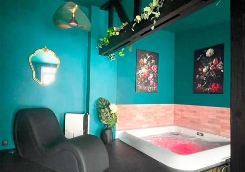 a bathroom with a bath tub in a room at NUITS D'EXIL in Gérardmer