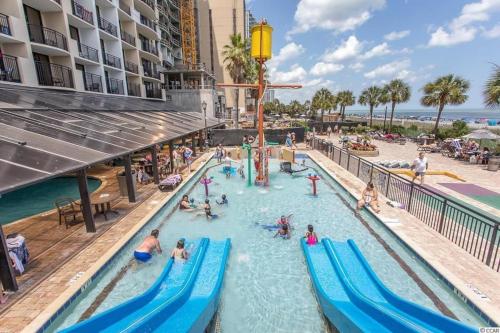 a pool at a resort with people playing in it at Breakers Resort in Myrtle Beach