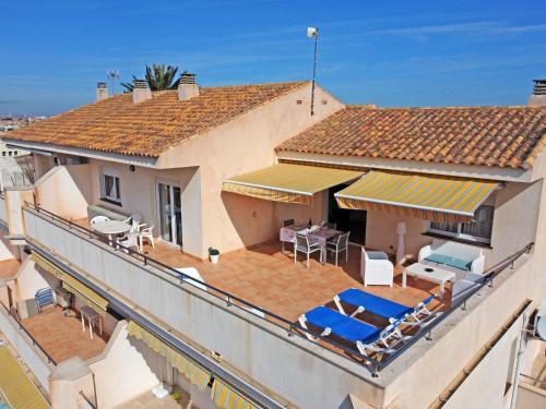 an aerial view of a house with a deck and chairs at CABO DE PALOS ATICO LA GALERA parking in Cabo de Palos