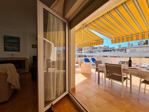 a dining room with a view of a cruise ship at CABO DE PALOS ATICO LA GALERA parking in Cabo de Palos