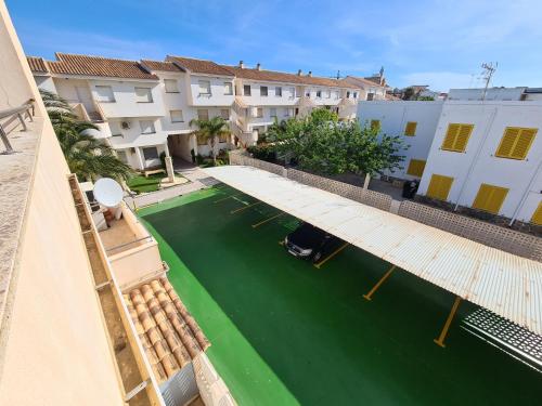 an aerial view of a green canal with buildings at CABO DE PALOS ATICO LA GALERA parking in Cabo de Palos