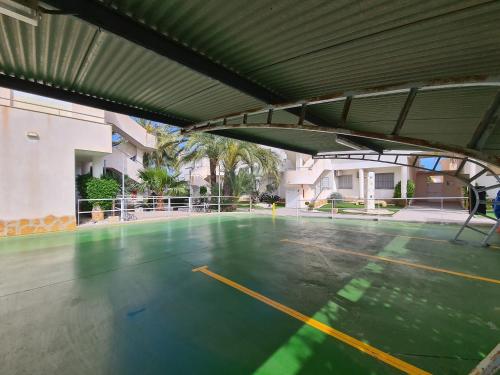 an empty basketball court in a building with awning at CABO DE PALOS ATICO LA GALERA parking in Cabo de Palos