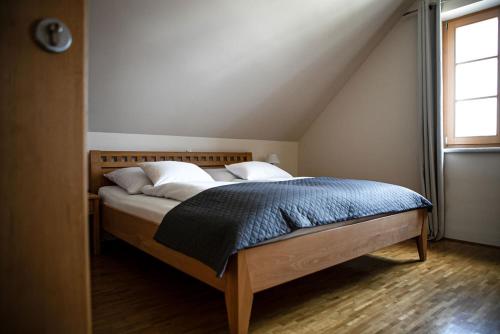 a bedroom with a bed in a attic at Ferienwohnung Weingut Rennhofer in Eisenberg an der Pinka