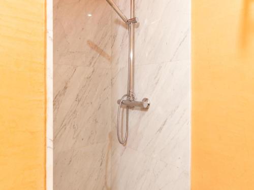 a shower with a shower head in a bathroom at NICE HOUSE in VILA VELLA TOSSA DE MAR in Tossa de Mar
