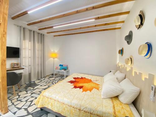 a bedroom with a bed and a desk at Sunshine Apartments in Sidari