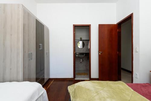 Katil atau katil-katil dalam bilik di Village Itaúna Inn - Casas de Temporada para Famílias
