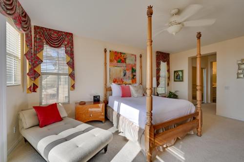 a bedroom with a four poster bed and a couch at Luxury Encinitas Vacation Rental with Private Pool in Encinitas