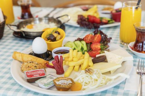 a plate of food on a table with food on it at KİRAZ BEACH OTEL in Erdek