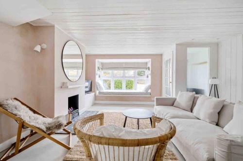 a living room with a couch and a table at sea side cottage near beach in West Wittering