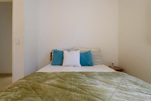 Katil atau katil-katil dalam bilik di Village Itaúna Inn - Casas de Temporada para Famílias
