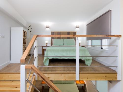 a bedroom with a bunk bed in a loft at Esquina de Alberto N1 con WiFi, cerca de la playa en Garachico - ES-279-3 in Garachico
