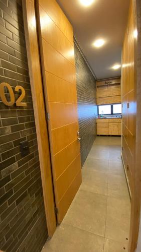 a hallway with a door in a room at REVU 519 in Tepic